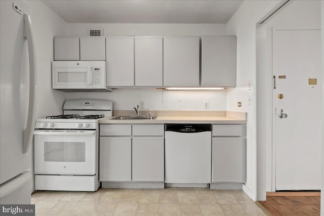 4501 Arlington Blvd Unit 709, Arlington, VA 22203 - kitchen featuring white appliances, a sink, light countertops, and white cabinetry