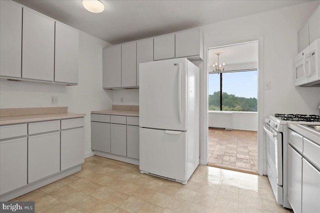 4501 Arlington Blvd Unit 709, Arlington, VA 22203 - kitchen featuring white appliances, a chandelier, and light countertops