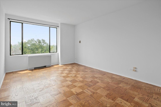 4501 Arlington Blvd Unit 709, Arlington, VA 22203 - empty room with radiator heating unit and baseboards
