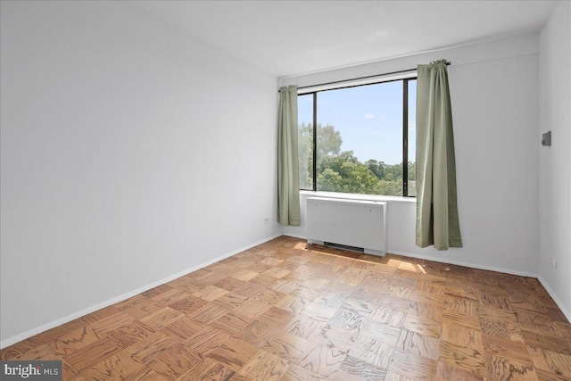 4501 Arlington Blvd Unit 709, Arlington, VA 22203 - empty room featuring radiator heating unit and baseboards