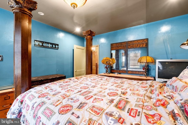 bedroom featuring decorative columns