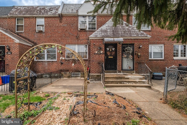 back of house with cooling unit, brick siding, fence, and a patio