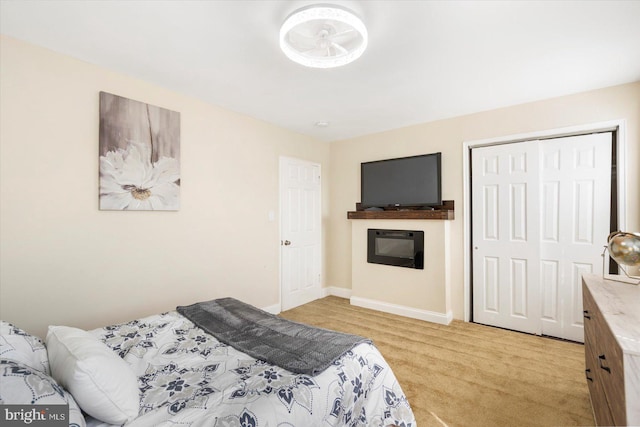 4548 Derby Manor Dr, Baltimore, MD 21215 - bedroom featuring baseboards, light carpet, and a closet