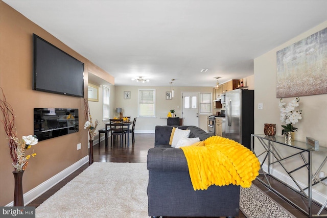 4548 Derby Manor Dr, Baltimore, MD 21215 - living area featuring baseboards and dark wood-type flooring