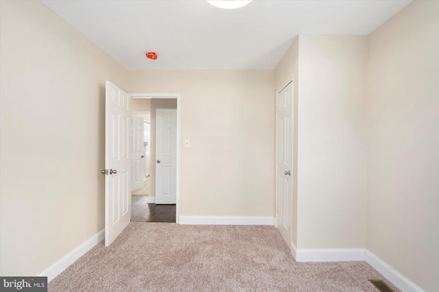 4548 Derby Manor Dr, Baltimore, MD 21215 - unfurnished bedroom featuring carpet floors, a closet, visible vents, and baseboards