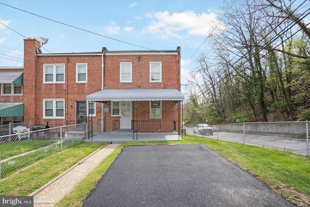 4548 Derby Manor Dr, Baltimore, MD 21215 - townhome / multi-family property featuring fence and brick siding