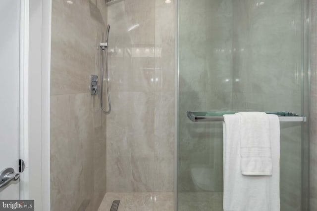 full bath featuring a tile shower