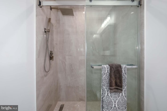 full bath featuring a shower stall