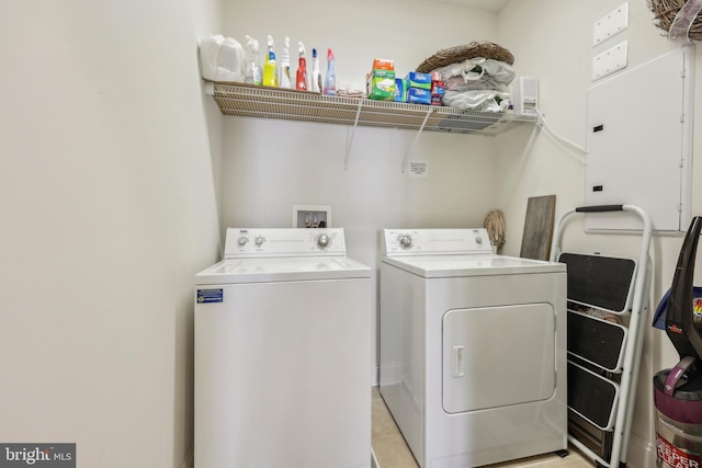 9200 Charleston Dr Unit 408, Manassas, VA 20110 - clothes washing area with washer and dryer and light tile patterned flooring