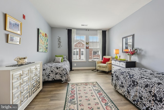 9200 Charleston Dr Unit 408, Manassas, VA 20110 - bedroom featuring wood finished floors and baseboards