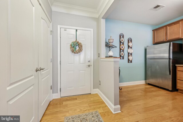 9200 Charleston Dr Unit 408, Manassas, VA 20110 - foyer featuring ornamental molding, light wood-style flooring, and baseboards