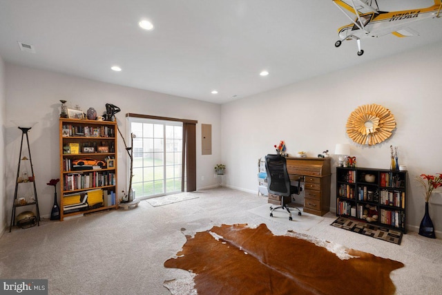carpeted office space featuring recessed lighting, baseboards, visible vents, and electric panel