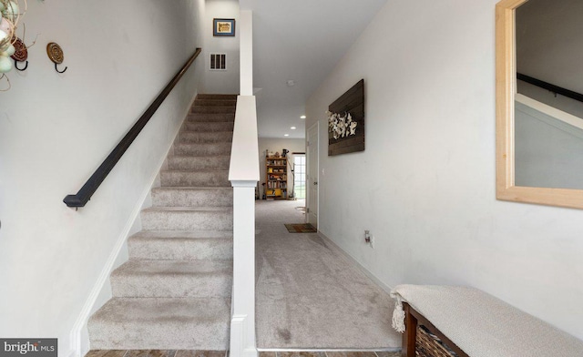 stairs with carpet floors, recessed lighting, and visible vents
