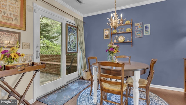 501 Tulip Rd, Riva, MD 21140 - dining space featuring wood finished floors, a chandelier, and ornamental molding