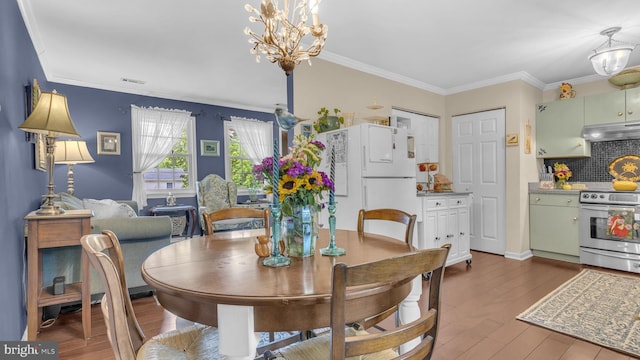 501 Tulip Rd, Riva, MD 21140 - dining space with a chandelier, wood finished floors, and ornamental molding