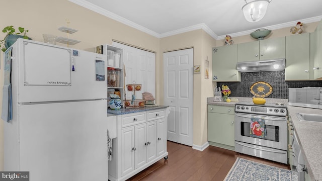 501 Tulip Rd, Riva, MD 21140 - kitchen with under cabinet range hood, stainless steel range oven, freestanding refrigerator, dark wood finished floors, and backsplash