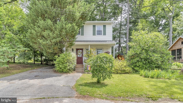 501 Tulip Rd, Riva, MD 21140 - view of front of house featuring covered porch, a front yard, and asphalt driveway