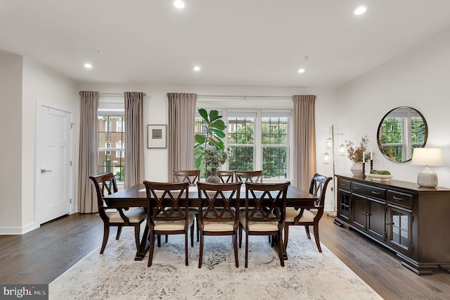dining space featuring dark wood finished floors, healthy amount of natural light, recessed lighting, and baseboards