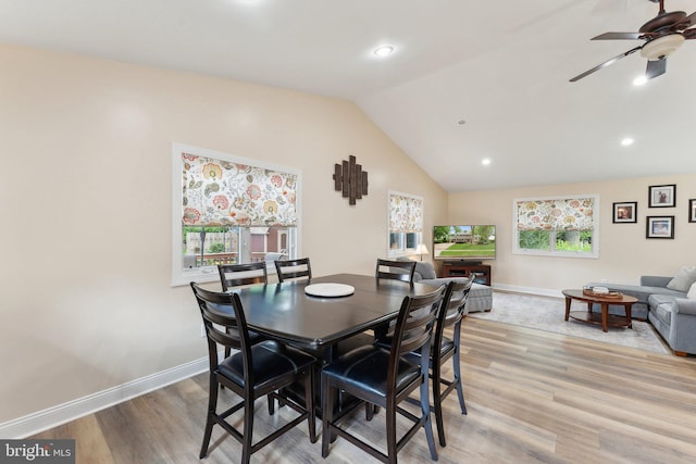 8807 Falkstone Ln, Alexandria, VA 22309 - dining area with lofted ceiling, light wood-style floors, a ceiling fan, and baseboards