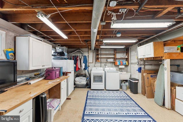 8807 Falkstone Ln, Alexandria, VA 22309 - unfinished below grade area featuring washer and dryer and light flooring