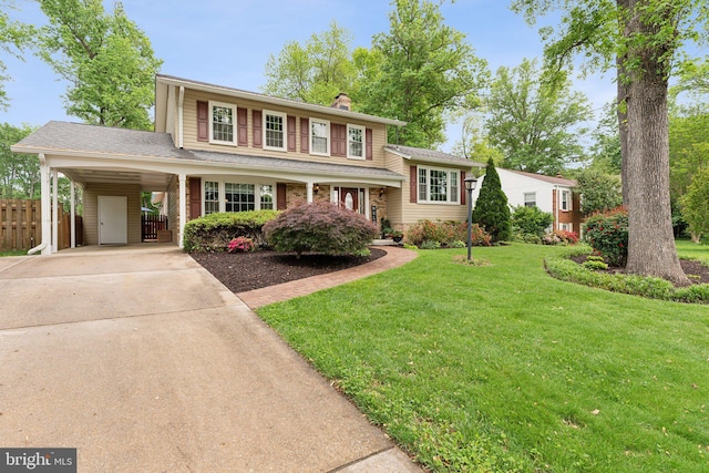 8807 Falkstone Ln, Alexandria, VA 22309 - split level home featuring fence, a chimney, a carport, a front yard, and driveway