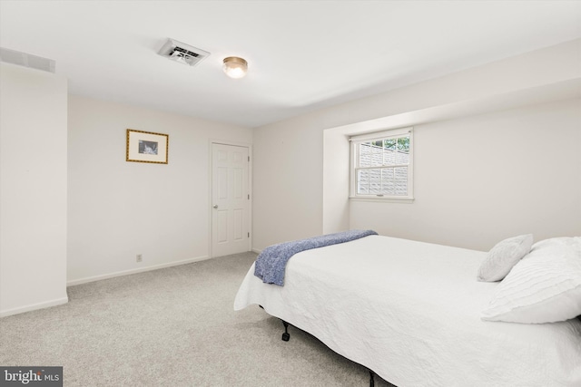 bedroom featuring carpet floors, baseboards, and visible vents
