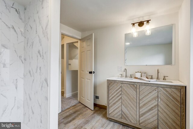 615 Burke Ave, Jenkintown, PA 19046 - full bathroom with wood finished floors, double vanity, and baseboards
