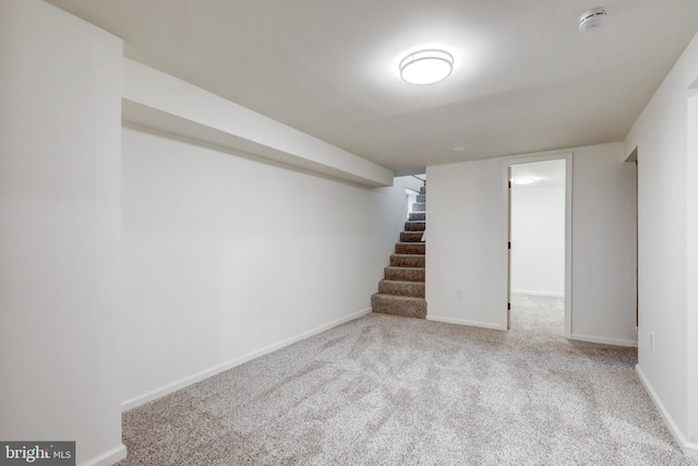 615 Burke Ave, Jenkintown, PA 19046 - finished basement with carpet flooring, stairway, and baseboards