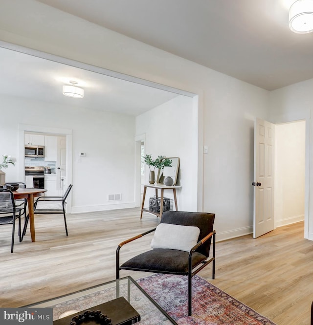 615 Burke Ave, Jenkintown, PA 19046 - living area featuring light wood finished floors and baseboards