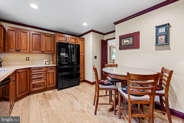 1902 Northleigh Rd, Lutherville Timonium, MD 21093 - kitchen featuring black appliances, ornamental molding, tasteful backsplash, brown cabinetry, and light stone countertops