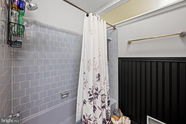 1902 Northleigh Rd, Lutherville Timonium, MD 21093 - bathroom with shower / bathtub combination with curtain and a wainscoted wall