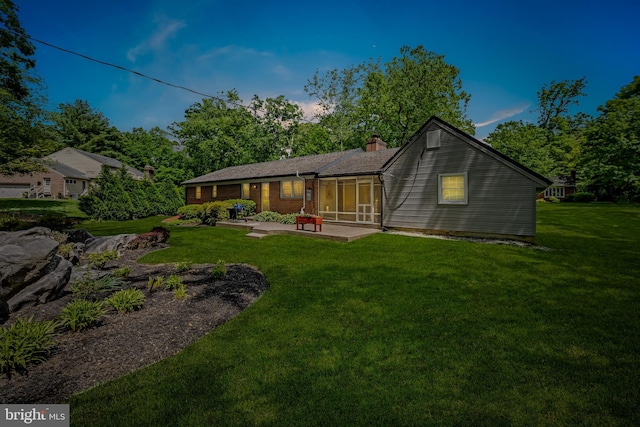 1902 Northleigh Rd, Lutherville Timonium, MD 21093 - back of house featuring a chimney, a lawn, and a patio