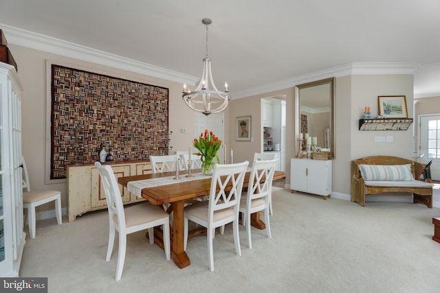 dining area with crown molding, baseboards, an inviting chandelier, and light carpet
