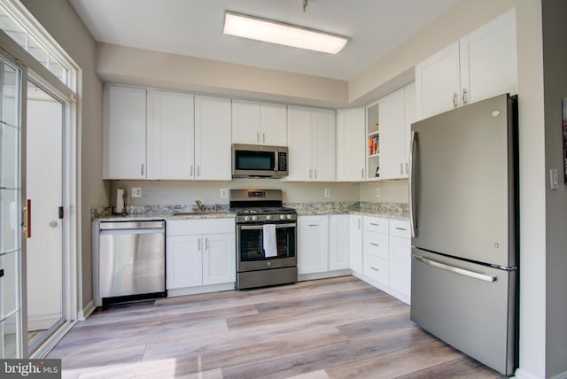 11405 Windleaf Ct Unit K # 24, Reston, VA 20194 - kitchen with white cabinets, appliances with stainless steel finishes, and light stone counters