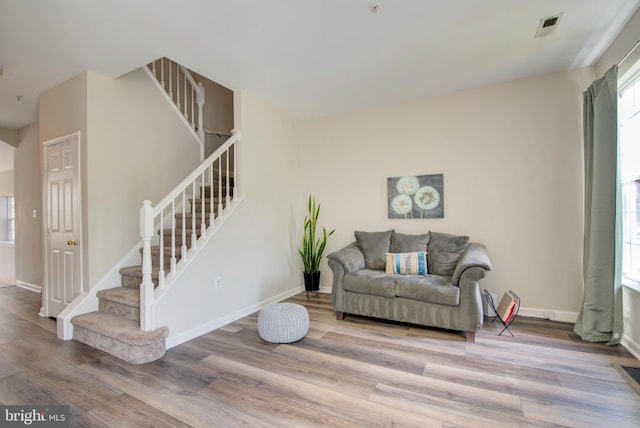 11405 Windleaf Ct Unit K # 24, Reston, VA 20194 - living room featuring visible vents, stairway, wood finished floors, and baseboards