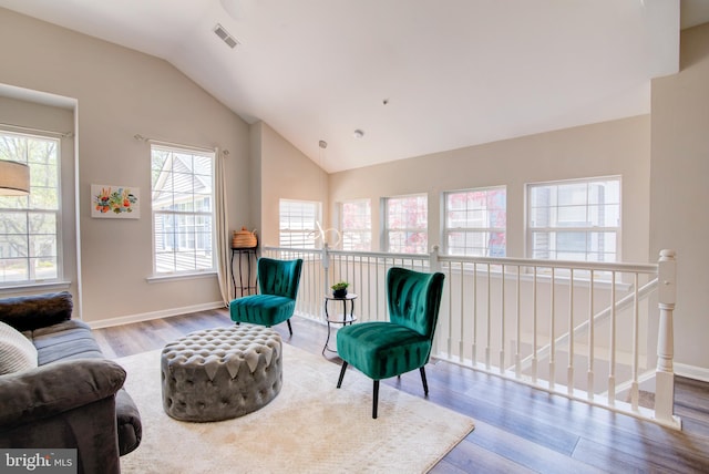11405 Windleaf Ct Unit K # 24, Reston, VA 20194 - living area with wood finished floors, visible vents, vaulted ceiling, and baseboards