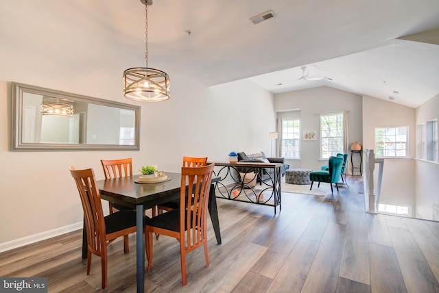 11405 Windleaf Ct Unit K # 24, Reston, VA 20194 - dining room with visible vents, baseboards, vaulted ceiling, wood finished floors, and ceiling fan with notable chandelier