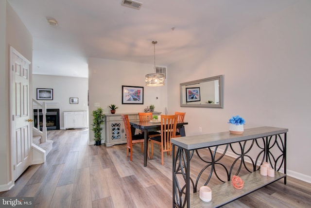 11405 Windleaf Ct Unit K # 24, Reston, VA 20194 - dining space featuring wood finished floors, visible vents, a notable chandelier, and baseboards