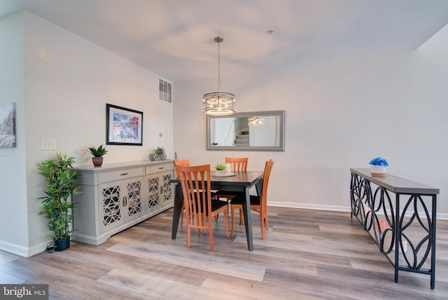 11405 Windleaf Ct Unit K # 24, Reston, VA 20194 - dining area featuring visible vents, an inviting chandelier, wood finished floors, and baseboards