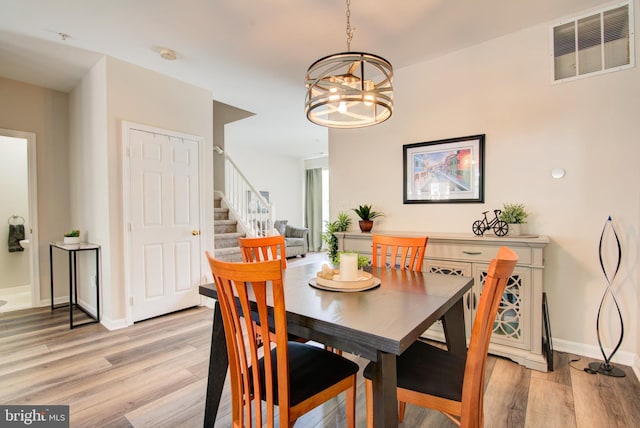 11405 Windleaf Ct Unit K # 24, Reston, VA 20194 - dining room with visible vents, an inviting chandelier, stairway, baseboards, and light wood-type flooring