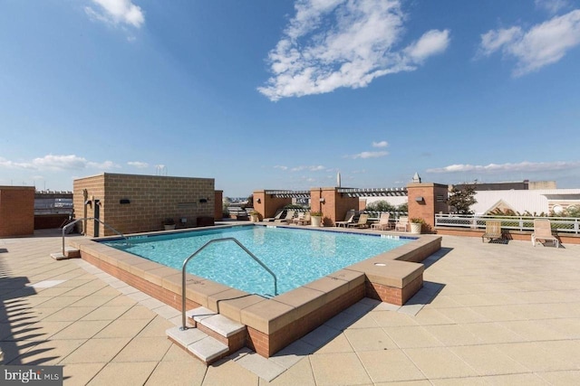 community pool featuring a patio area