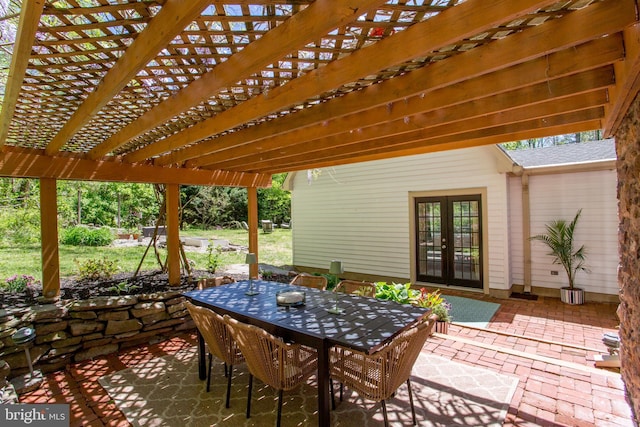 view of patio with a pergola, french doors, and outdoor dining space