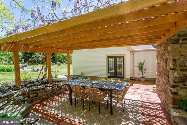 view of patio with a pergola, french doors, and outdoor dining space
