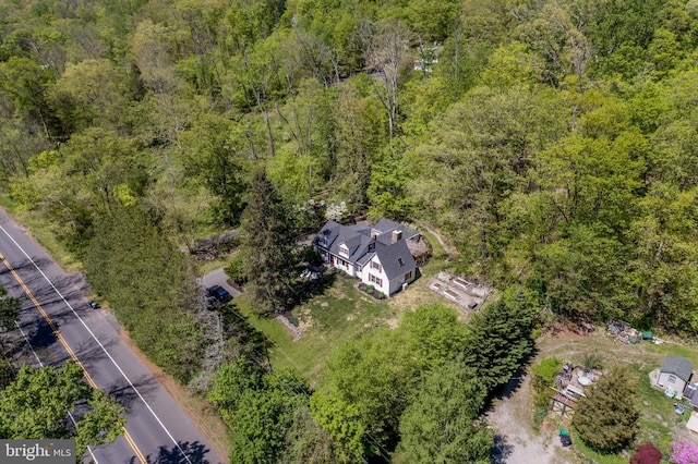 aerial view featuring a wooded view