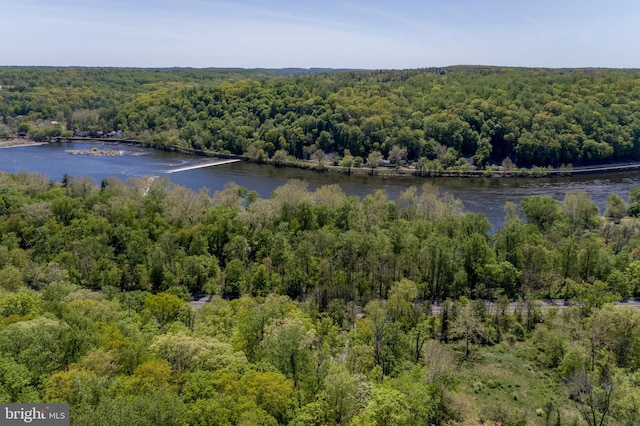 bird's eye view with a forest view and a water view