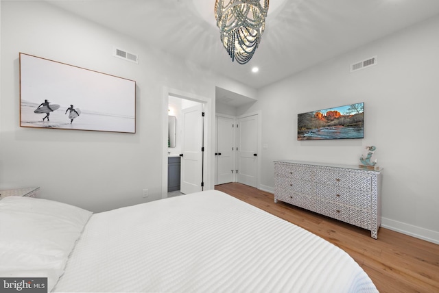15 W Harding Ave, Long Beach Township, NJ 08008 - bedroom with wood finished floors, baseboards, recessed lighting, a chandelier, and ensuite bathroom