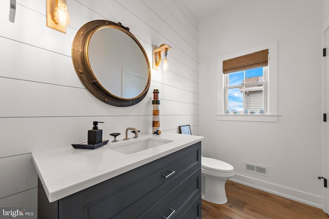 15 W Harding Ave, Long Beach Township, NJ 08008 - bathroom with wood finished floors, vanity, toilet, and baseboards