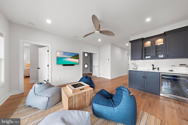 15 W Harding Ave, Long Beach Township, NJ 08008 - living area featuring wine cooler, bar with sink, light wood-style floors, baseboards, and recessed lighting