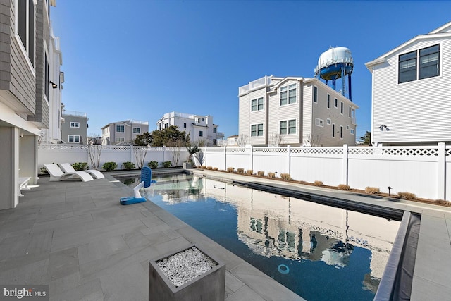 15 W Harding Ave, Long Beach Township, NJ 08008 - view of swimming pool with a fenced backyard, a patio, and a residential view