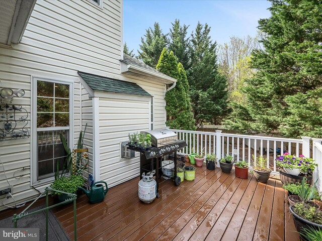 wooden deck featuring grilling area
